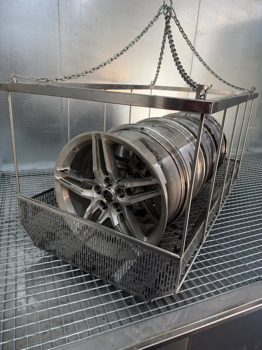 Wheels in a metal basket inside the equipment